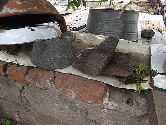 Two reused pre-Hispanic mortars in the house of a neighbor